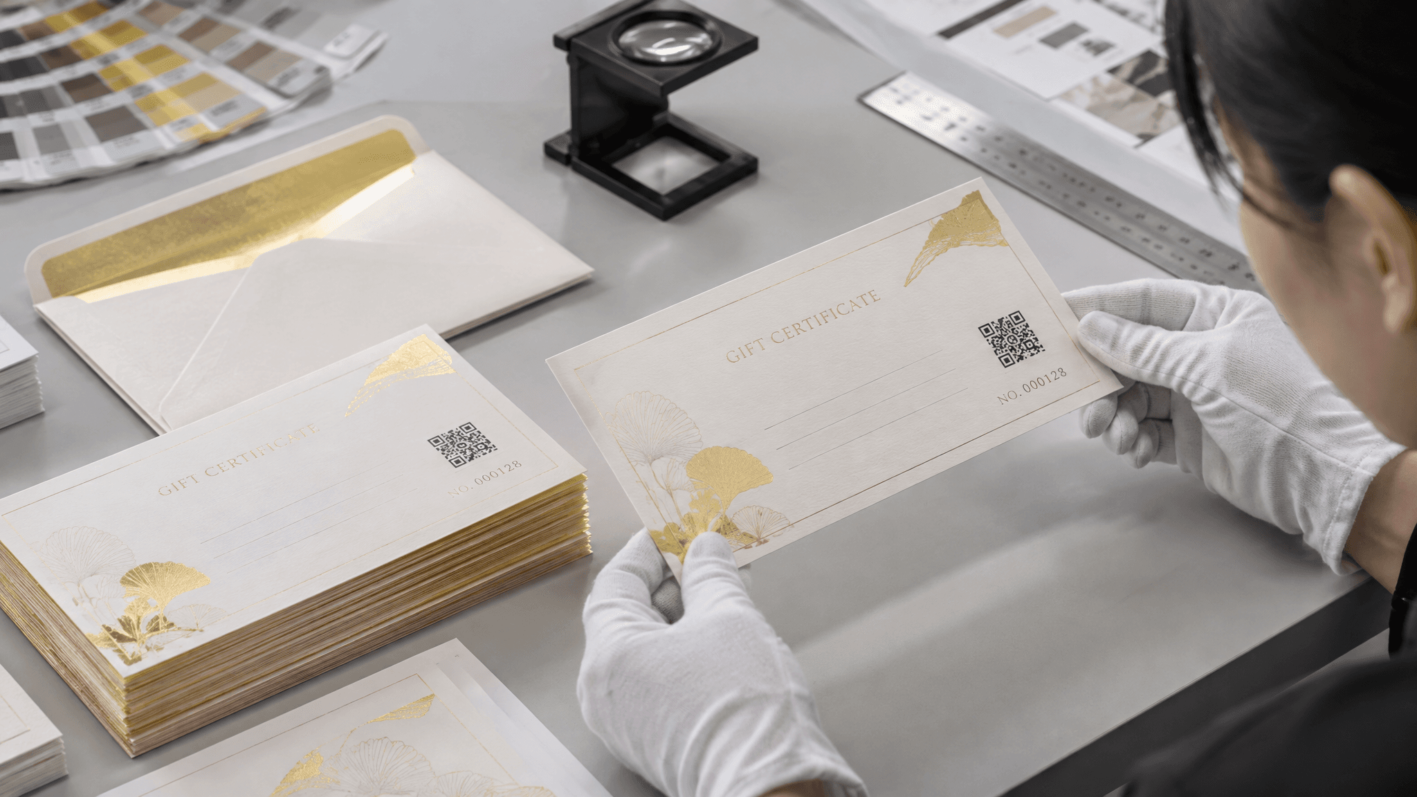 Custom printed gift certificates with writable fields, serial numbering, QR code area and foil detail