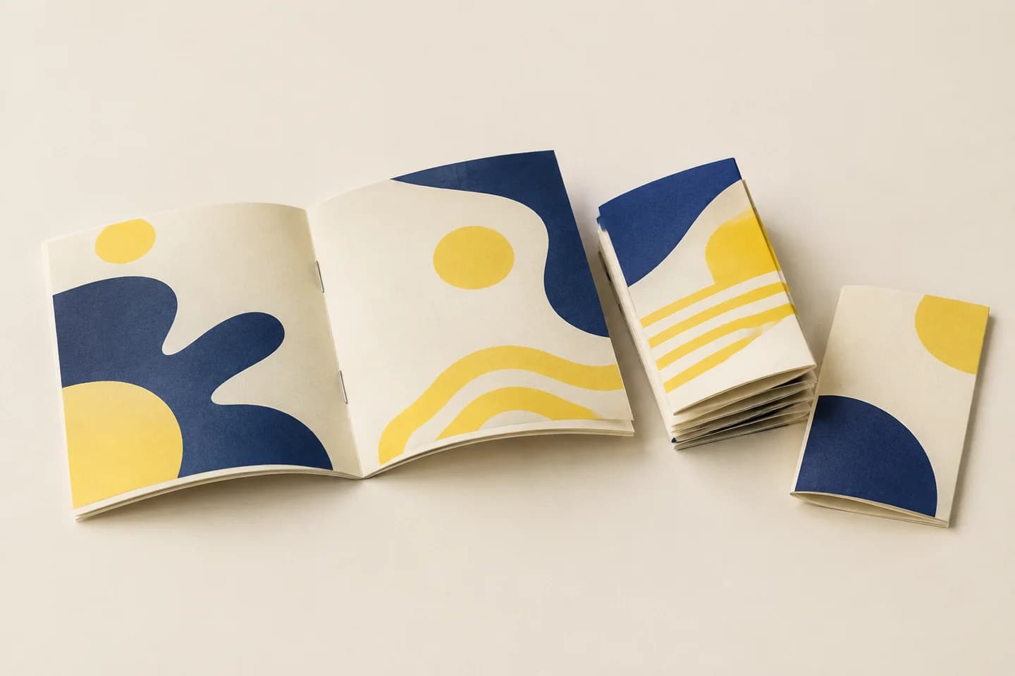Saddle-stitched booklet showing two fold staples and nested paper sheets