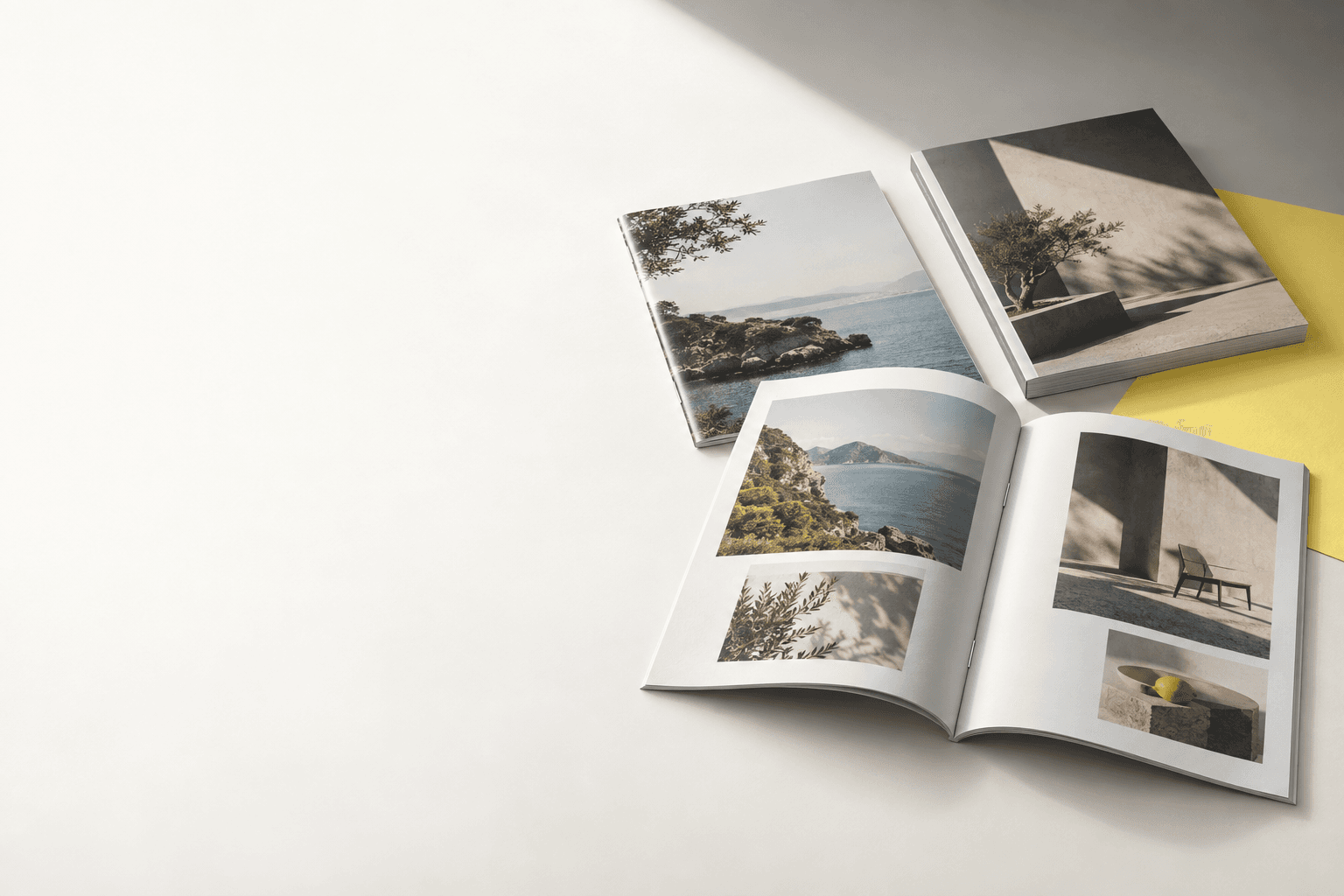 Open contemporary magazine and printed issues in a studio