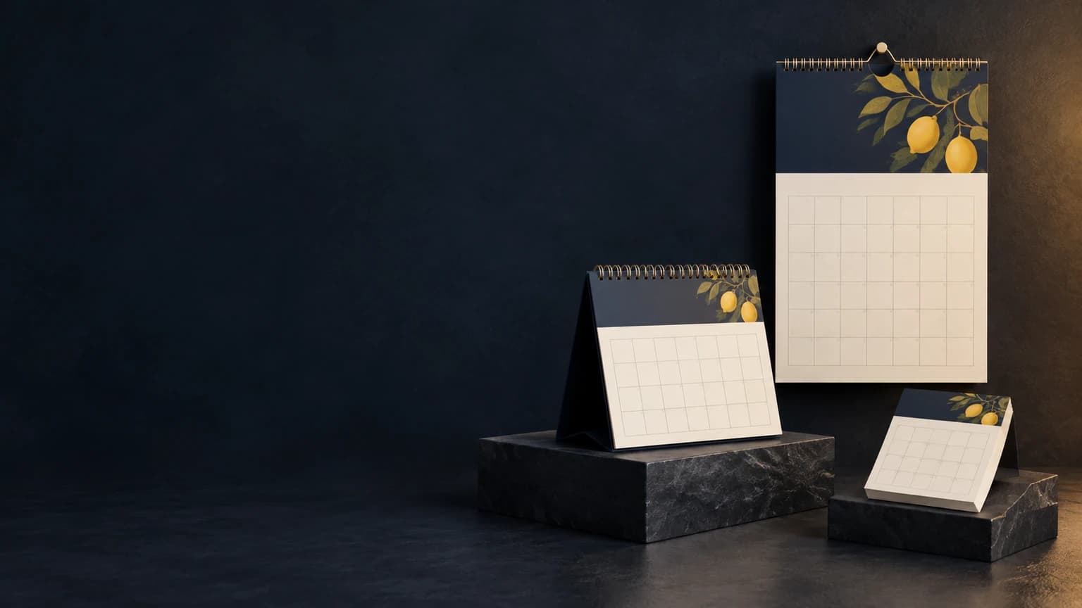 Illustrative wall calendar, wire-bound desk calendar and tear-off calendar pad on a dark studio background