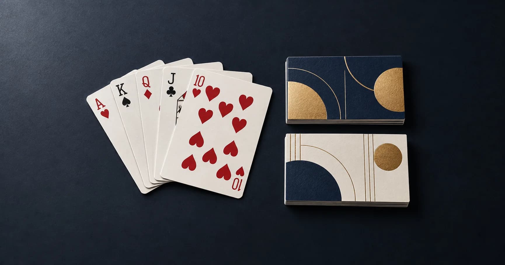Custom printed playing cards fanned beside neat stacks of premium business cards