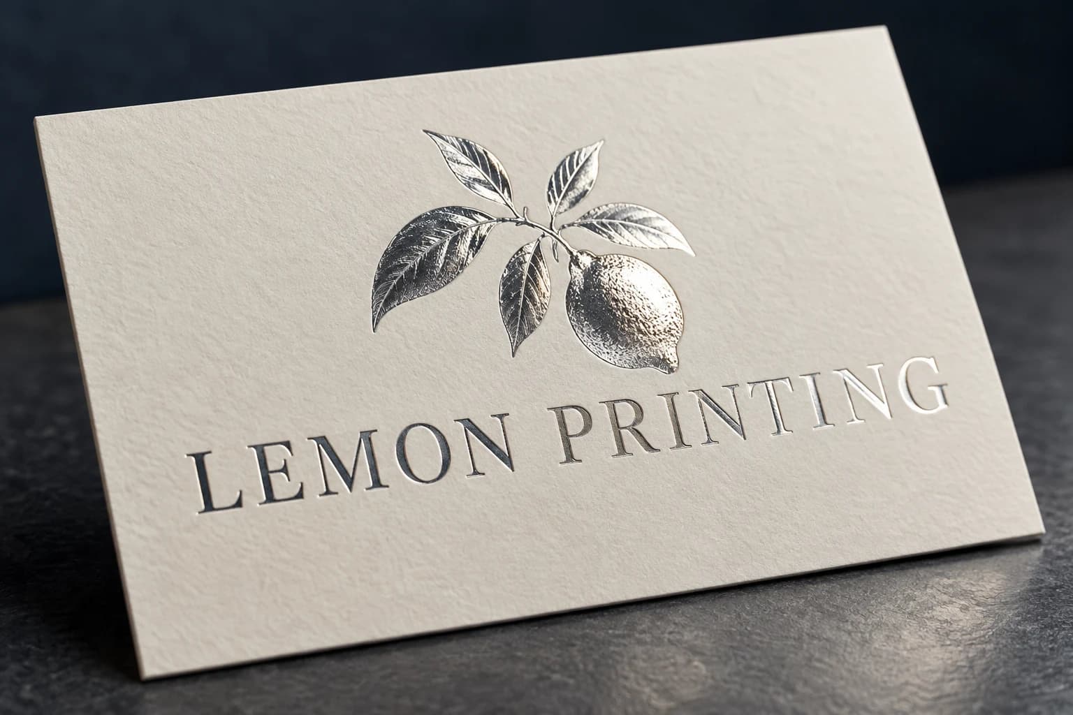 Silver-foil Lemon Printing brand mark on an ivory card; AI-generated finish illustration for Lemon Printing